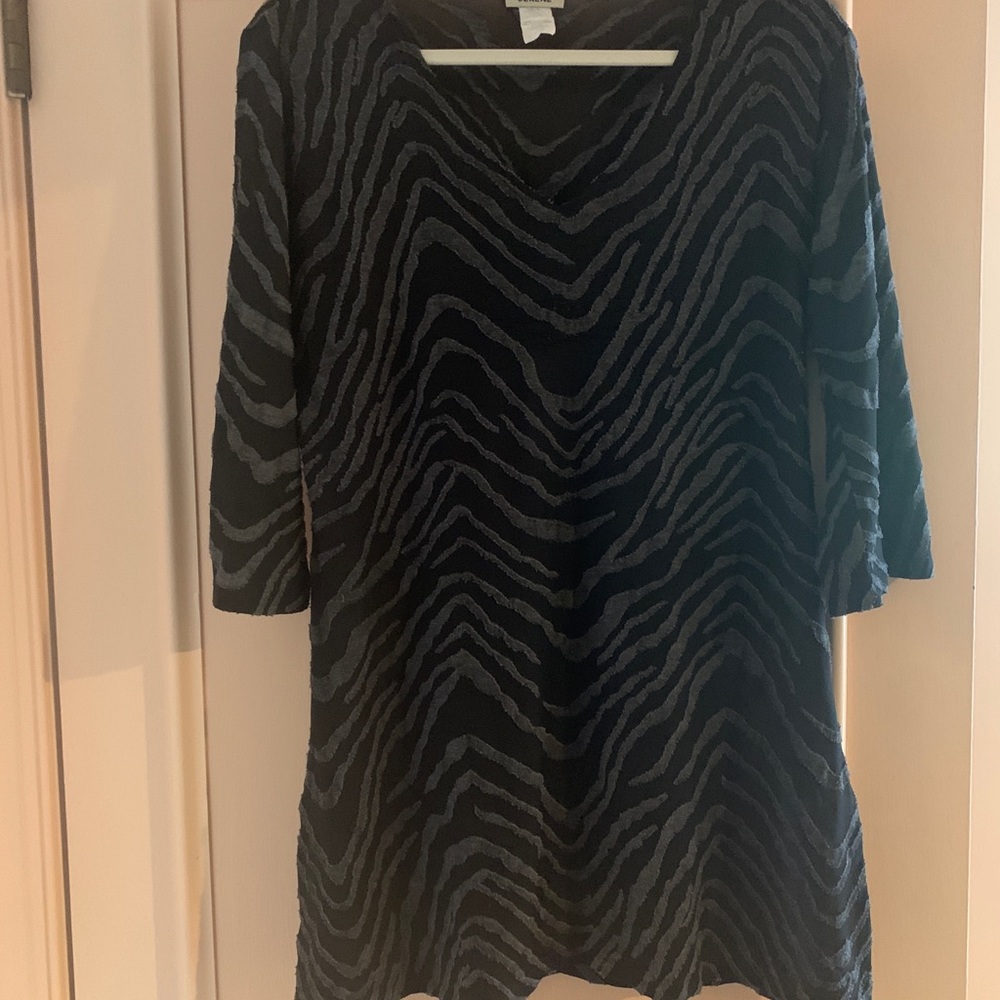 Sheer tunic with subtle animal print texture.